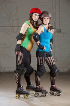 Serious adult female roller derby skaters as friends