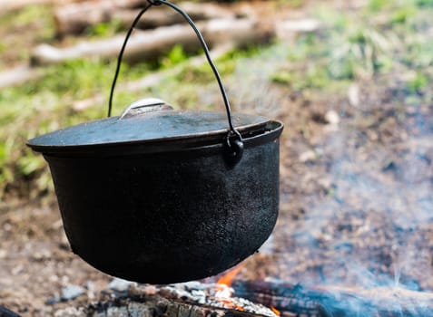 Cooking in the cauldron on the open fire.