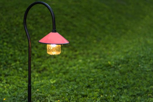 Beautiful garden walkway lighting with lamps at night