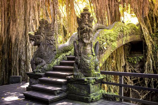 Dragon sculpture on the bridge in monkey forest, Ubud, Bali.