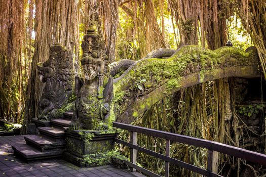 Dragon sculpture on the bridge in monkey forest, Ubud, Bali.