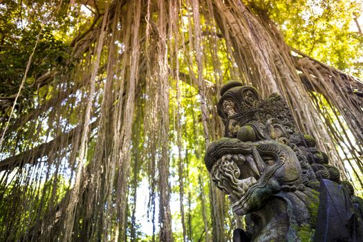 Dragon sculpture on the bridge in monkey forest, Ubud, Bali.