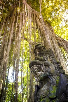 Dragon sculpture on the bridge in monkey forest, Ubud, Bali.
