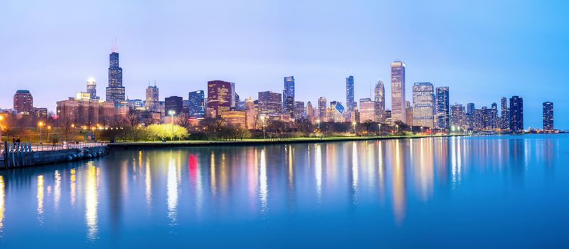 Panorama of Chicago downtown City and Lake Michigan at dusk.