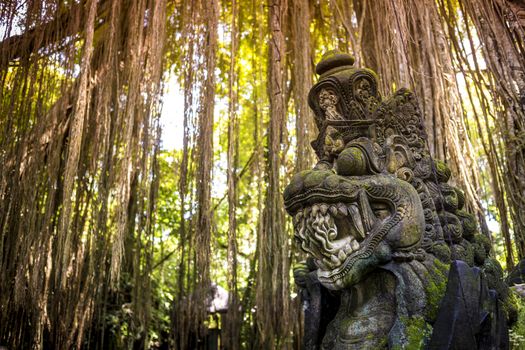 Dragon sculpture on the bridge in monkey forest, Ubud, Bali.