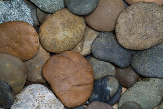 Pile of round peeble stones for background