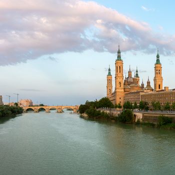 Panorama of Our Lady of the Pillar Basilica with Ebro River at dusk Zaragoza, Spain