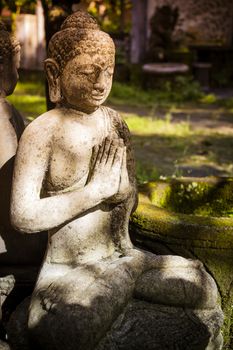 The old stone Buddha statue. Indonesia, Bali.
