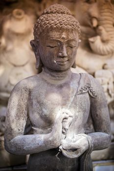 The old stone Buddha statue. Indonesia, Bali.
