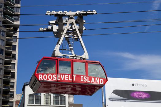 New York, USA-October 9, 2014: The famous Roosevelt Island cable tram car that connects Roosevelt Island to Manhattan Uptown. Each cabin has a capacity of up to 110 people and makes app 115 trips per day.