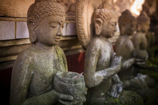 The old stone Buddha statue. Indonesia, Bali.
