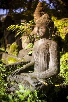 The old stone Buddha statue. Indonesia, Bali.
