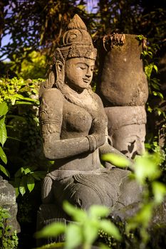 The old stone Buddha statue. Indonesia, Bali.

