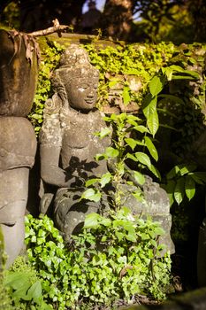 The old stone Buddha statue. Indonesia, Bali.
