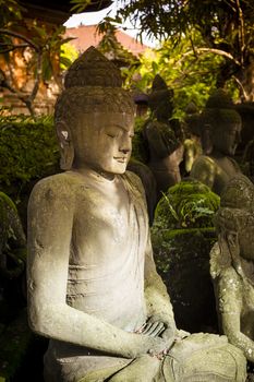 The old stone Buddha statue. Indonesia, Bali.
