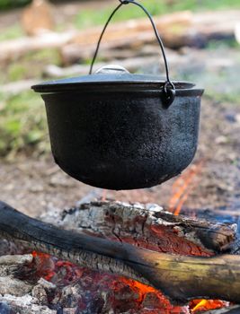 Cooking in the cauldron on the open fire.