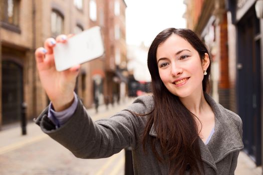 young woman taking a selfie. 