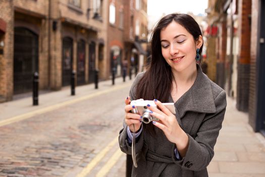 young woman looking at hers photo's