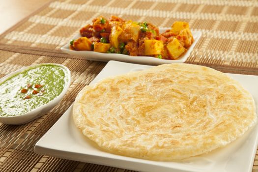 Paratha with green chutney and mixed aloo bhaaji vegetables