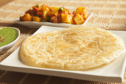 Paratha with green chutney and mixed aloo bhaaji vegetables