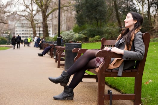 young woman sitting in the park