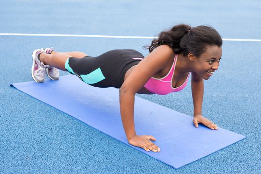 young woman doing push ups