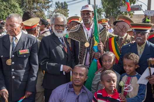 Addis Ababa - Sept 2: Young children pose to take pictures with the war veterans at the 119th Anniversary Celebrations of the Ethiopian Army's victory over the invading Italian forces in the 1896 battle of Adwa. September 2, 2015, Addis Ababa, Ethiopia.