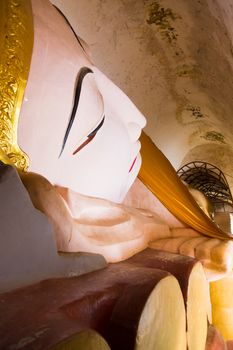 Huge Reclining Buddha Image at Manuha Pagoda, Bagan, Myanmar.