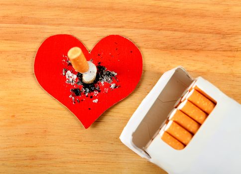 Cigarette in Heart Shape on the Table