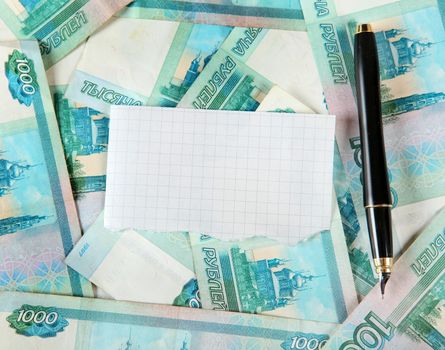 Russian Currency and Blank Paper with a Pen closeup