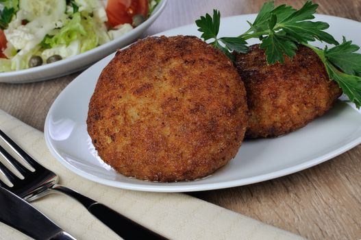 Chicken cutlets in bread crumbs on the dining table