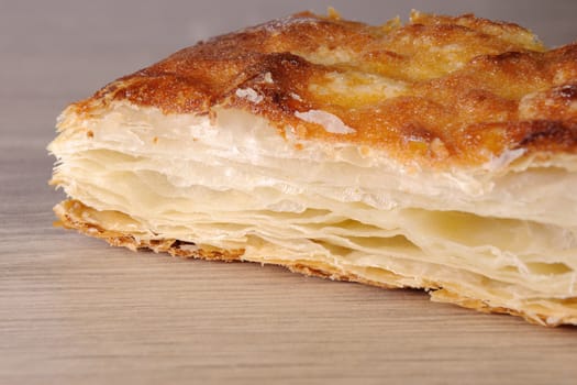 A piece of baked puff pastry in the incision