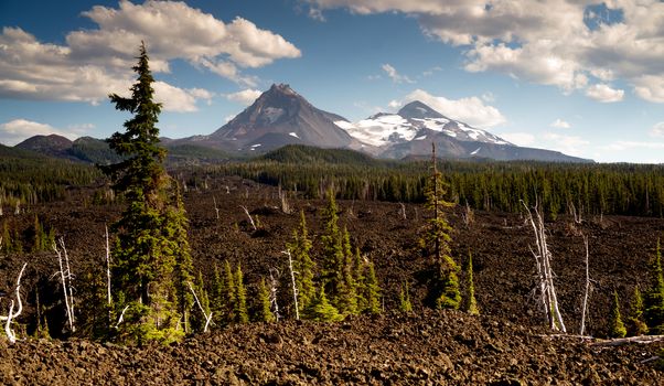 A seemingly endless field of lava leads out to the Sisters near Bend Oregon