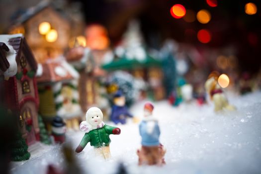 Miniature Christmas Village under Xmas Tree Closeup