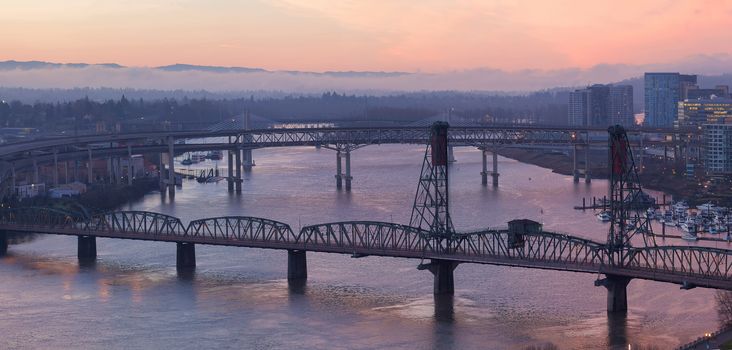 Sunrise Over Bridges of Portland Oregon downtown cityscape along Willamette River Aerial View Panorama