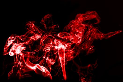 red smoke with light on black background