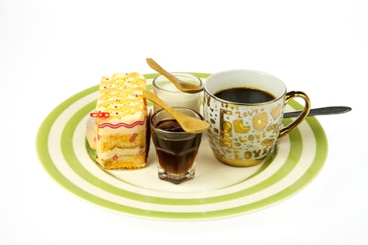 tasty cake at plate closeup with coffee cup nd delicious orange cake