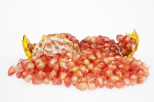 Ripe pomegranate fruit on the white background