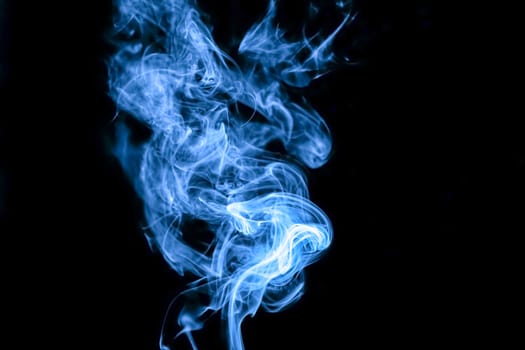 Blue smoke on black background