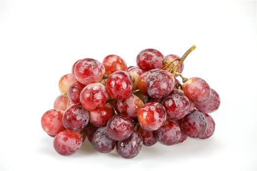 Close up red grape were plastic bags ready for sale on white background
