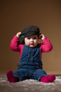 infant baby with black hat - the first year of the new life