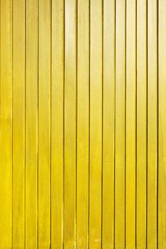 Yellow wood plank wall texture background.