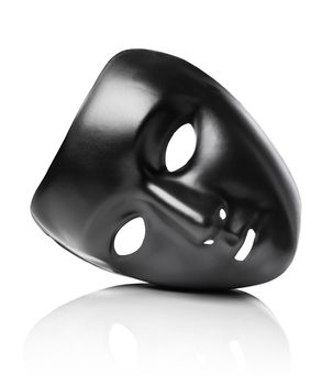 Black plastic mask isolated on white with natural reflection.