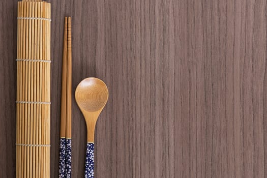 Blue decorated sushi bamboo chopsticks and spoon