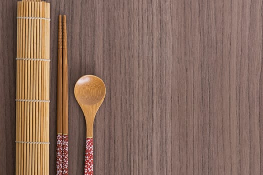 Pink decorated sushi bamboo chopsticks and spoon  