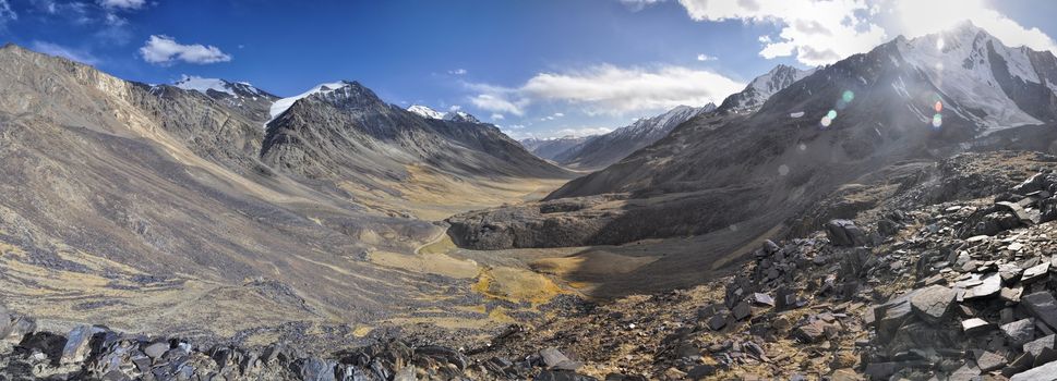 Scenic panorama of cold arid landscape in Tajikistan on sunny day