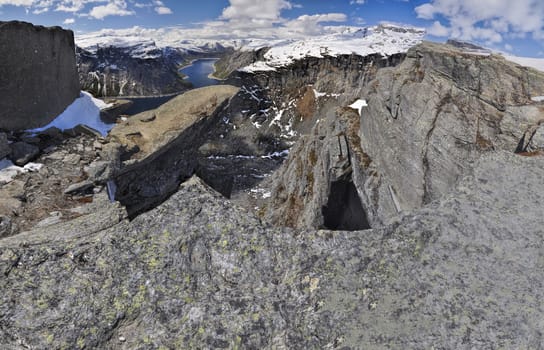 Scenic view of Trolltunga rock  and the surrounding mountains in Norway