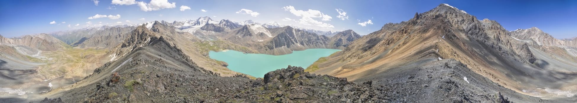 Scenic panorama of picturesque turquoise lake in Tien-Shan mountains in Kyrgyzstan