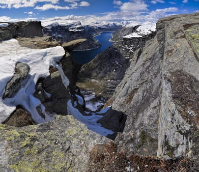 Scenic view of Trolltunga rock  and the surrounding mountains in Norway