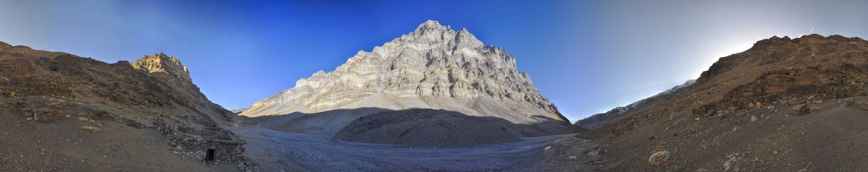 Scenic panorama of mountain on arid landscape in Tajikistan on sunny day